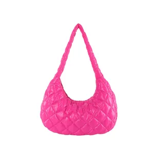 Quilted cloud shoulder bag in magenta nylon with diamond stitch and crescent shape