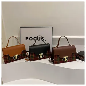 Chic retro plaid handbags in three colors displayed on a white minimalist platform