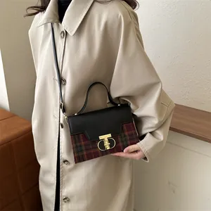 Vintage plaid crossbody bag with gold buckle on a beige trench coat outfit