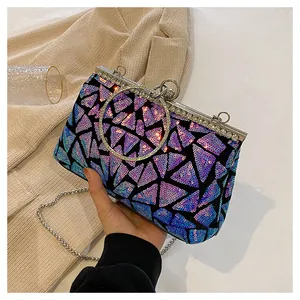Detail view of purple gradient sequins and rhinestone ring handle on the evening clutch