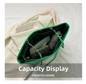 Macro view of green metallic tote bag showing large capacity for daily essentials