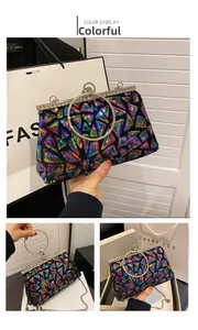 Detail of multicolor sequin evening bag with diamond-encrusted ring handle and metal chain