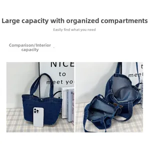 Macro shot of large denim tote bag interior showing capacity with a smartphone for scale