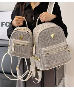 Detailed comparison of tweed backpack set in large and small sizes with golden hardware