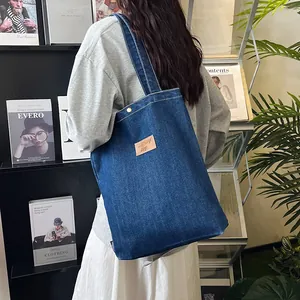 Deep blue denim tote bag with leather embroidery patch for school and commute use
