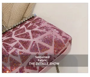 Detailed close-up of pink sequin fabric and rhinestone metal frame on the evening clutch
