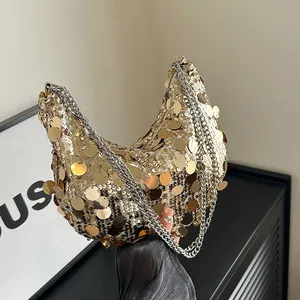 Chic gold sequin crescent shoulder bag with silver chain straps and reflective finish
