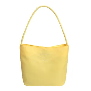Minimalist yellow nylon shoulder bag with pretty and libety white embroidery for women