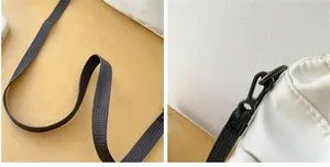 Detail of white nylon bucket bag showing black woven strap and durable hardware