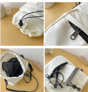 Detail view of white quilted nylon bucket bag with drawstring closure and mesh interior