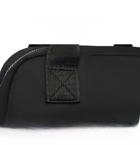 Detail show of durable X-shaped reinforced stitching on the black nylon backpack handle
