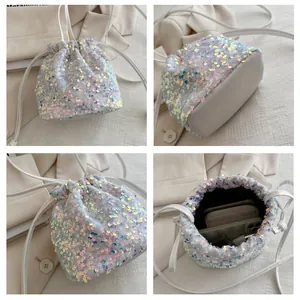 Detailed views of a white iridescent sequin bucket bag with drawstring closure and strap