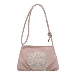 Elegante borsa a tracolla rosa con ricamo floreale e trama marmorizzata in stile cinese