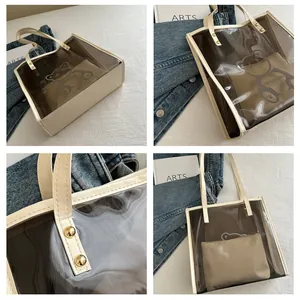 Macro detail of clear PVC tote with cartoon bear print and leather inner zipper pouch