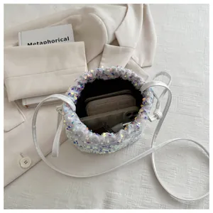 Top view showing storage capacity of a sequin bucket bag with drawstring closure