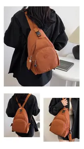 Three-way view of brown nylon chest bag showing multi-pocket layout and SPORT logo