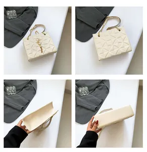 Detailopnames van beige gewatteerde handtas met gouden ketting en elegante kwastdecoratie