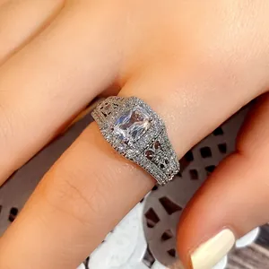 Exquisite silver ring with large rectangular zircon and pave diamonds on hand