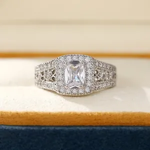 Macro view of square cushion-cut zircon ring with intricate filigree and pave details