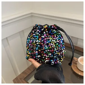 Macro shot of colorful sequins and drawstring closure on this mini bucket bag