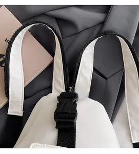Detail of convertible zipper straps switching from a single shoulder bag to a double backpack