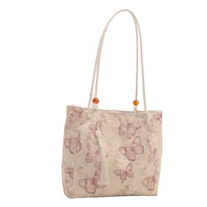 Large butterfly print tote bag with orange beads and elegant long white tassels