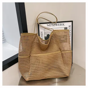 Beige mesh woven tote bag with side pockets and long shoulder straps for summer beach use