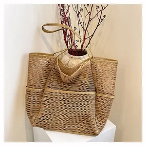 Minimalist khaki mesh beach tote bag with multiple pockets and long shoulder straps