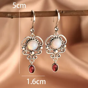 Vintage silver hollow-out earrings with white moonstone and red ruby pendants