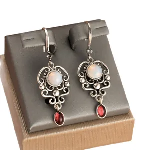 Vintage silver hollow-out earrings with white opal and red drop gemstone pendant