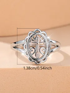 Detail showing vintage cross ring dimensions 1.38cm on a textured display stand