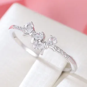 Exquisite S925 sterling silver bow ring with sparkling pear-cut diamonds in a butterfly design