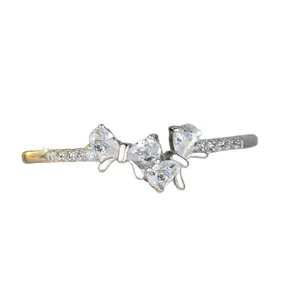 Elegant S925 sterling silver bow ring with sparkling pavé zircons on white background