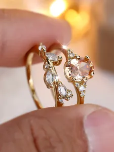 Detail showing champagne oval gemstone ring with marquise diamond leaf band set