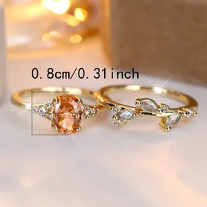 Elegant gold-plated ring set with oval orange gemstone and marquise-cut crystal vines