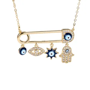 Elegant gold paperclip necklace featuring evil eye, star, and hamsa hand charms