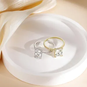 Elegant gold and silver square princess cut diamond rings with pave-set bands on silk