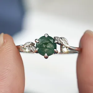 Classic S925 silver ring featuring a round green moss agate with leaf-shaped accents