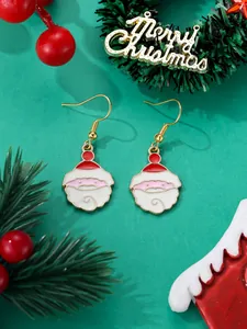 Detailed view of Santa Claus drop earrings with festive green holiday decorations