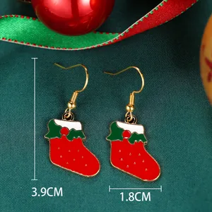 Macro shot of red Christmas sock earrings with 3.9cm height and 1.8cm width details