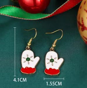 Detailed view of Christmas mitten earrings with dimensions 4.1cm by 1.55cm in festive red