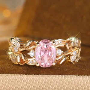 Vintage French style oval pink stone ring with floral gold vine band and clear crystals