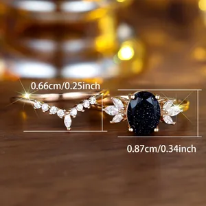 Tweedelige roségouden ringenset met blauwe zandsteen en marquise diamanten