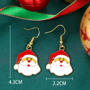 Detail view of Santa Claus earrings showing dimensions 4.3cm and 2.2cm in festive setting