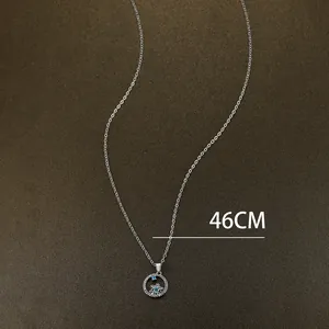 Detail of 46cm silver necklace with blue crystal snowflake hollow pendant design