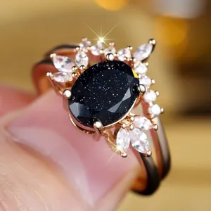 Vintage roségouden ring met ovale blauwe zandsteen en marquise-geslepen witte kristallen