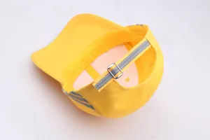 Yellow safety baseball cap with reflective stripes and adjustable metal buckle
