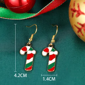 Detail view of candy cane earrings with size 4.2x1.4cm on festive background