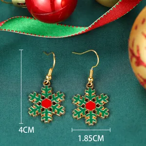 Detailed view of Christmas snowflake earrings in red and green with 4cm height dimension