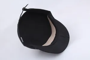 Black cotton cadet cap with adjustable bronze metal buckle and internal sweatband detail